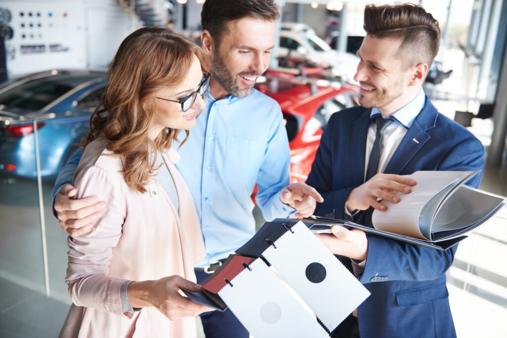 Mid adult couple looking at color brochures